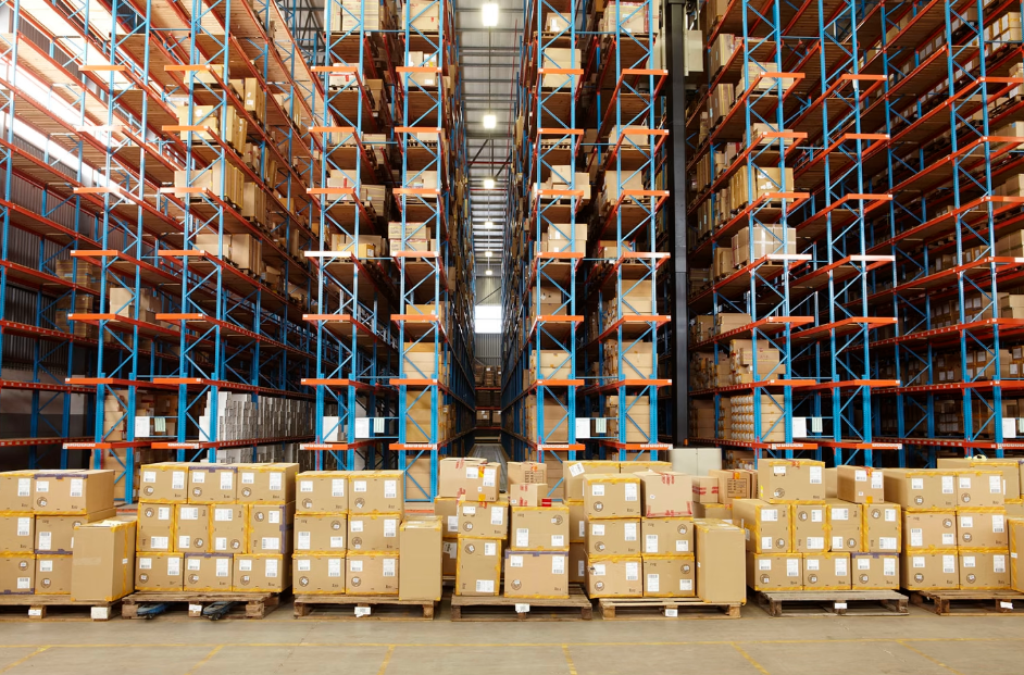 A warehouse with boxes stacked on shelves

Description automatically generated with medium confidence